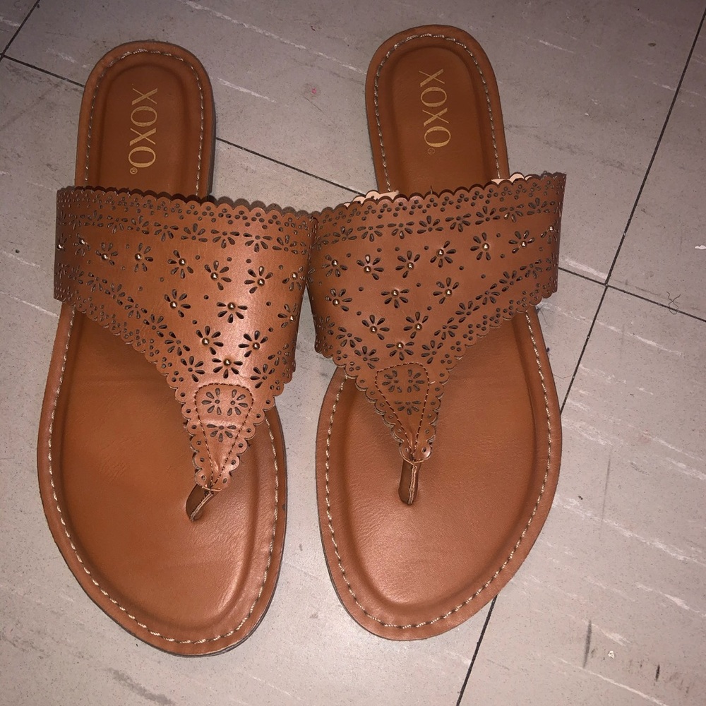 A Brown sandal with gold bling stones